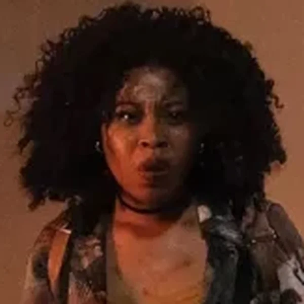 Dominique Fishback as Elena Wallace