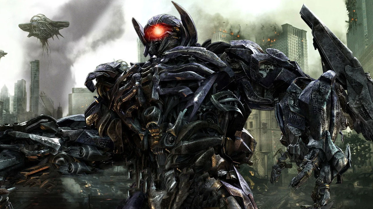 Autobots push through the rubble toward the control pillar.