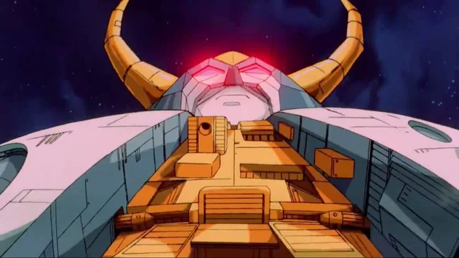 Unicron approaching in a still from the 1986 film The Transformers: The Movie, his horned face lit from within against a starfield, the flat cel colours and hard black outlines of hand drawn animation clearly visible