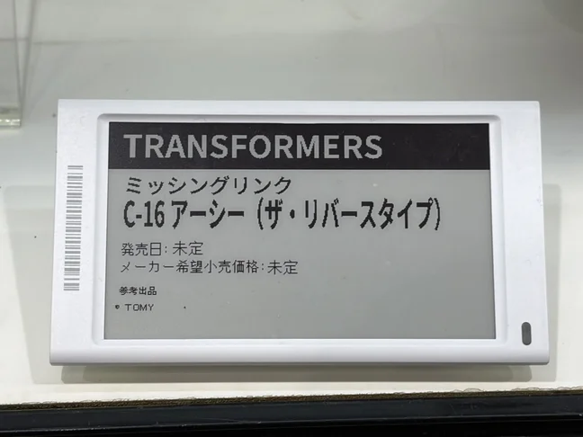 Takara's display card reading TRANSFORMERS, Missing Link, C-16 Arcee (The Rebirth Type), with release date and suggested retail price both undecided