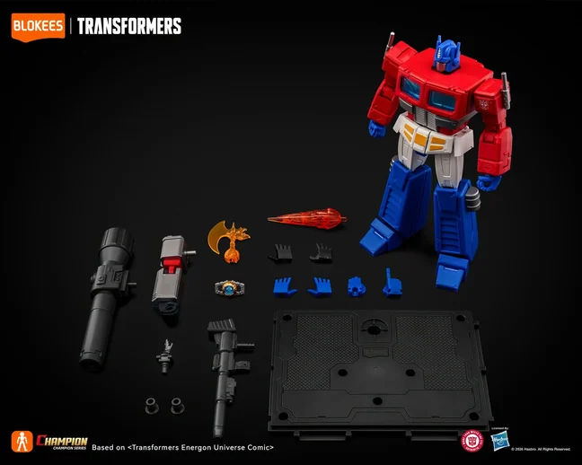 Blokees official contents photograph for the CC28 kit: the built Optimus Prime beside a long black cannon barrel, a grey forearm with a red housing, an orange Energon Axe, the Matrix as a silver ring around a blue crystal, a red blast effect, eight hands, a rifle, a connector, two grommets and a black display stand.