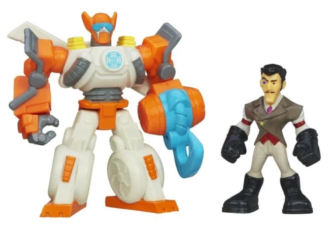 Hasbro's Rescue Bots two-pack on a white background: Blades the Copter-Bot in white, orange and grey with a blue hook accessory, beside a small non-articulated Doctor Morocco figure in a tan suit with black boots and gloves.