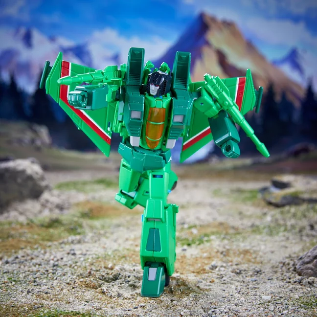 The green Seeker from the Studio Series Generation 1 Seeker Storm Pack, standing in robot mode with a null ray mounted on each forearm and wings swept back.